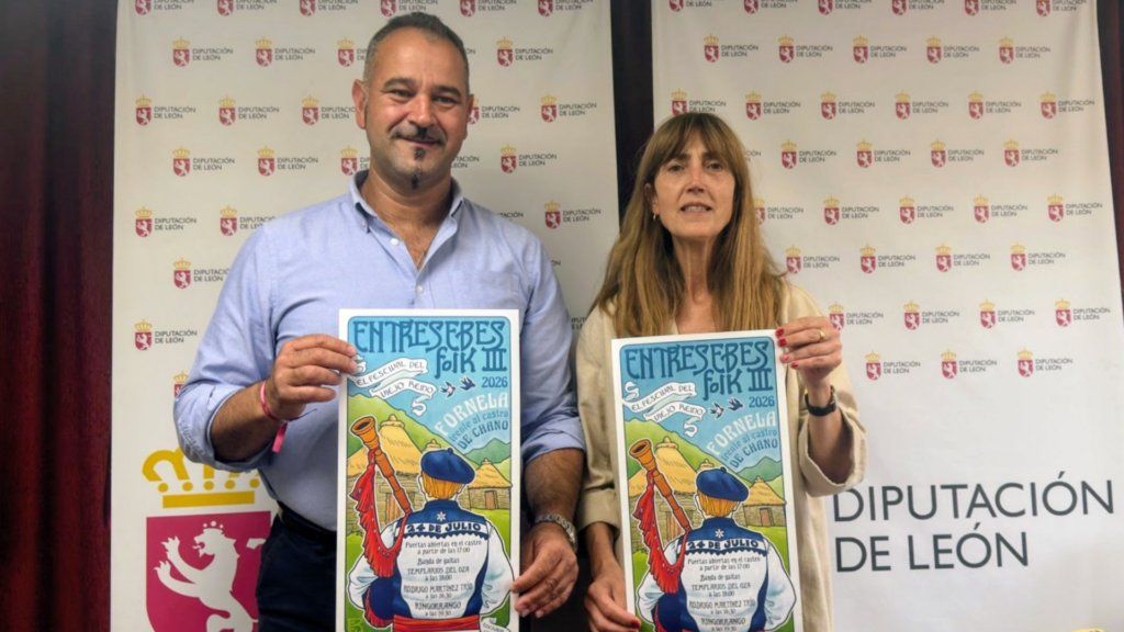 Presentación del III Festival Entresebes Folk con dos personas sosteniendo un cartel