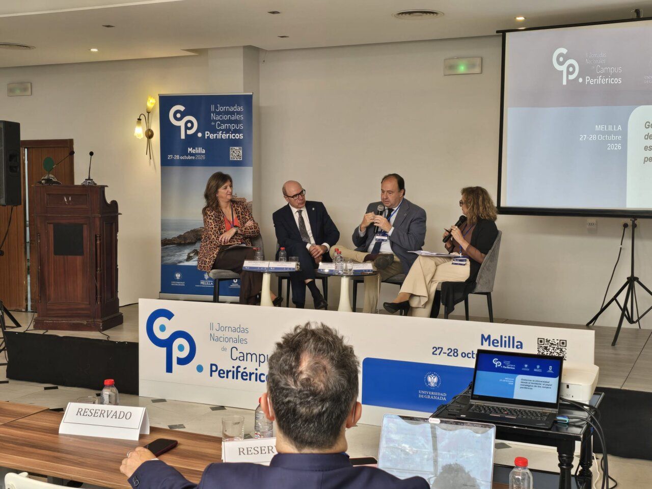 Cuatro personas participan en una mesa redonda de las Jornadas Nacionales de Campus Periféricos en Melilla.